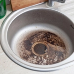 Dirty Sink at kitchen room. Clean a sink drain. unclog a kitchen sink without a disposal